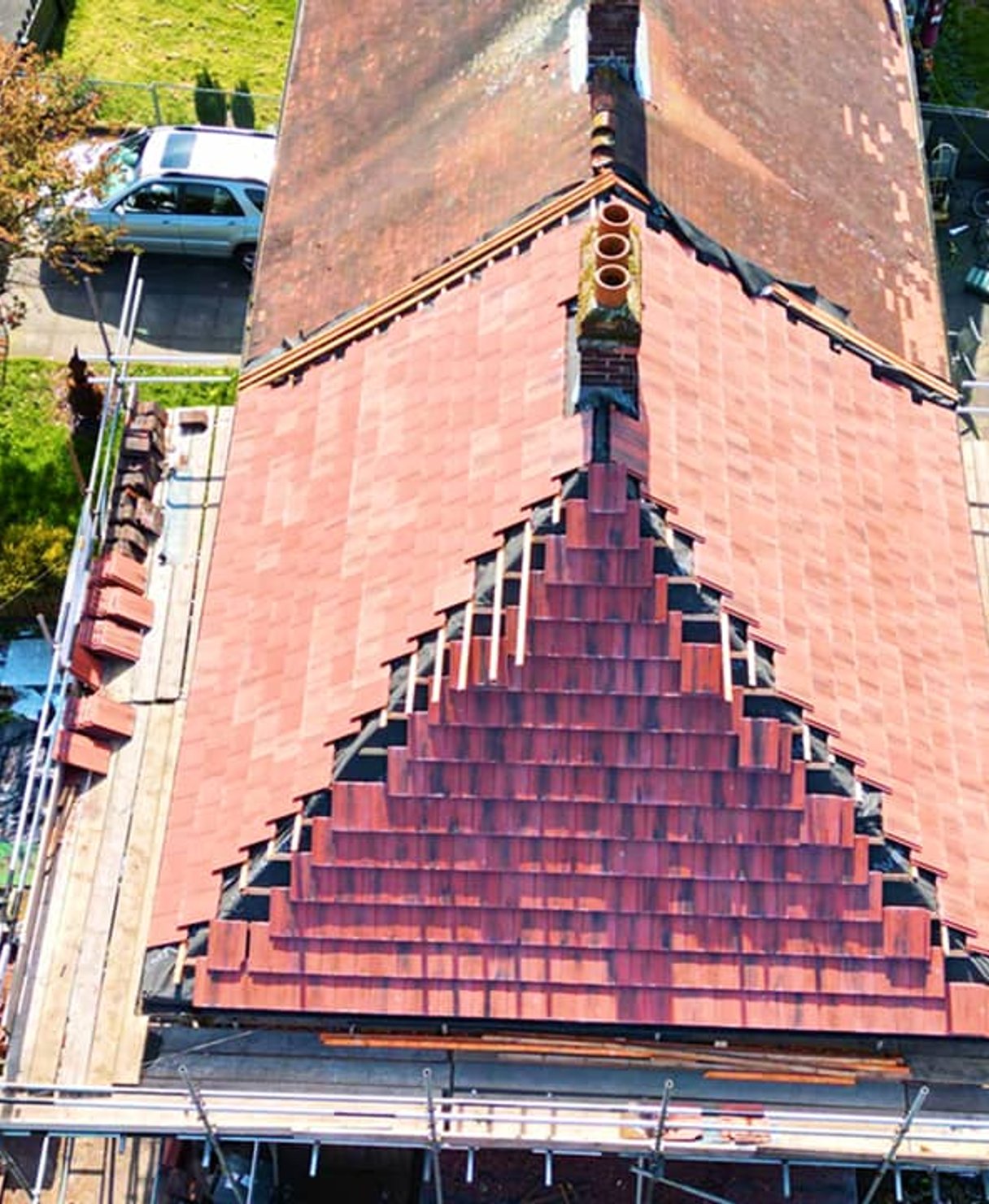 Aerial view of roof mid-replacement with scaffolding